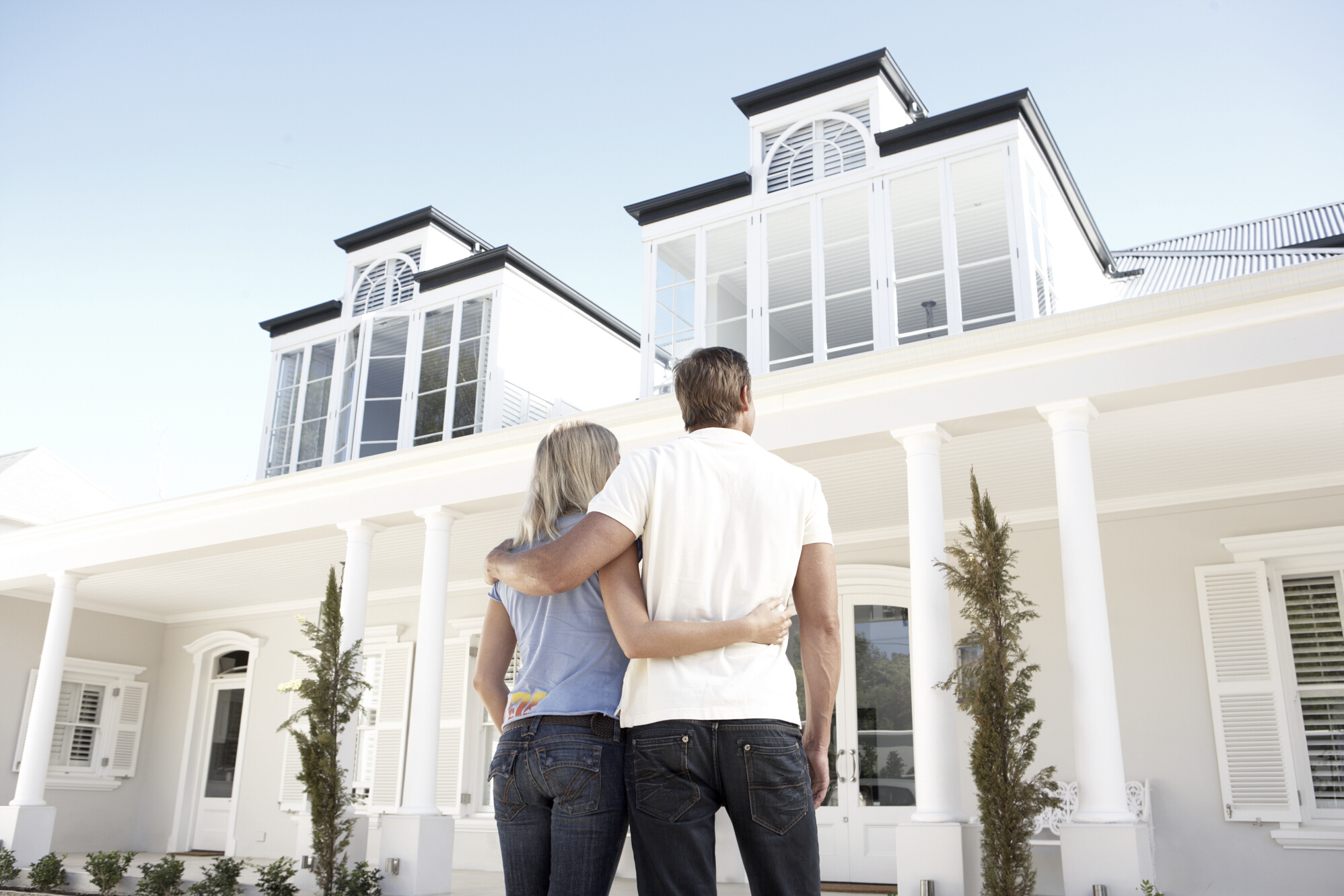 Couple Standing in Front of Dream House