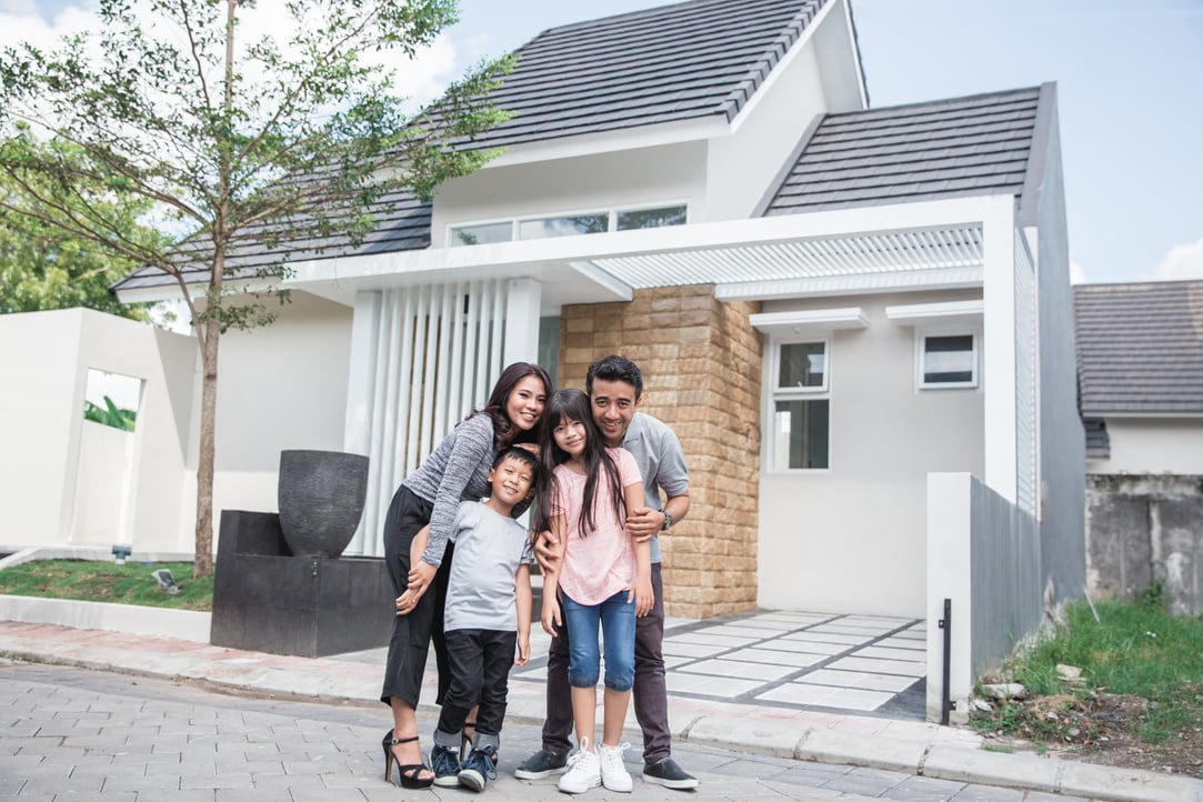 Family in Front of Their New House